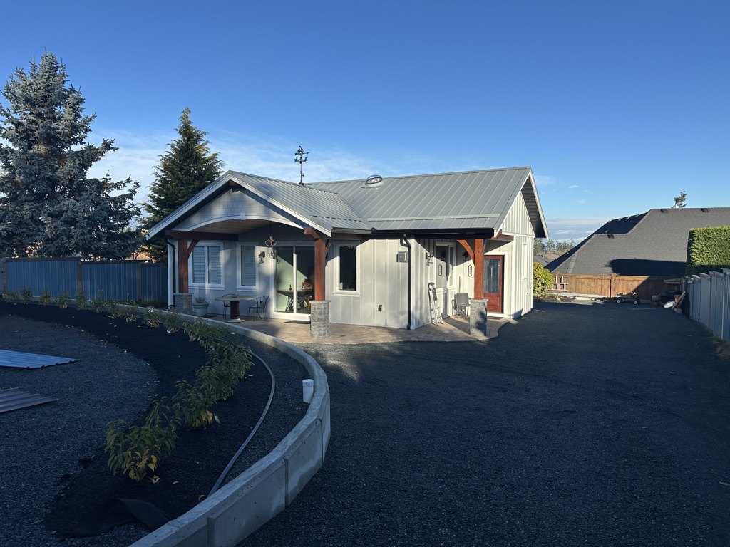 Rancher renovation with a new timber covered entry and paved driveway