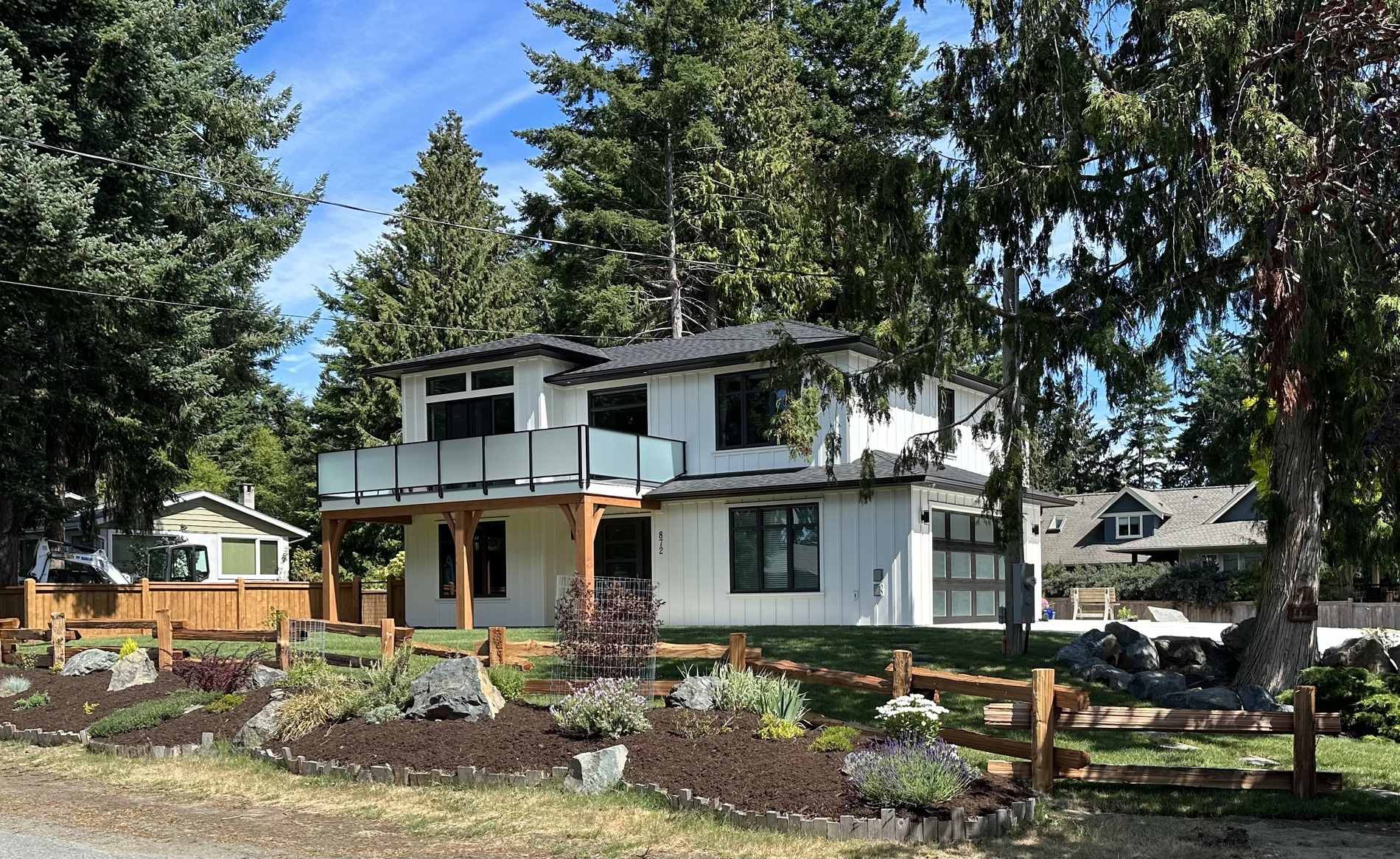 Two storey home built by VIP Homes with a covered timber entry and new landscaping
