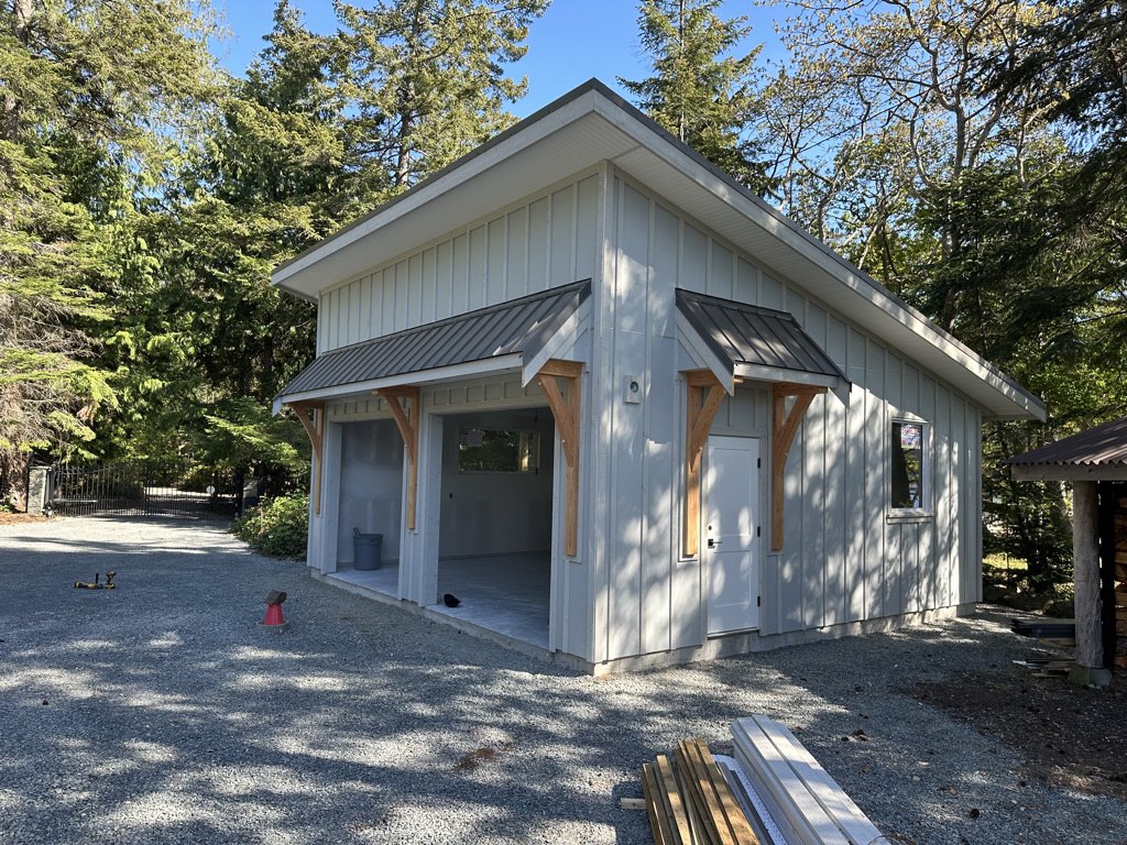 New detached workshop building with a timber post entry under construction