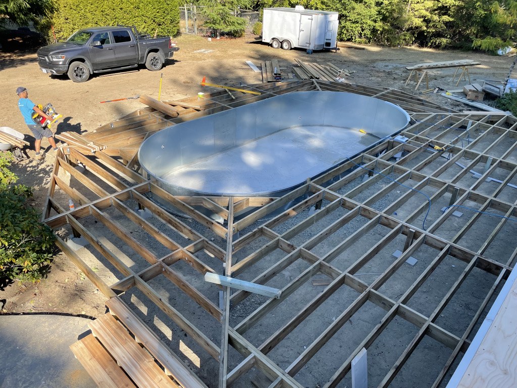 Deck framing built out around a new spa shell on a Vancouver Island property