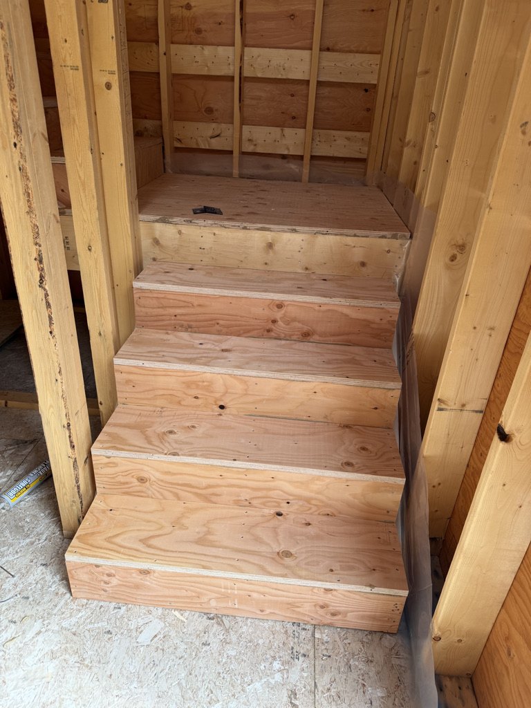 Stair stringers and treads framed in fir during construction
